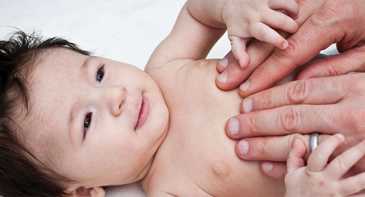 Banner baby with hands of father