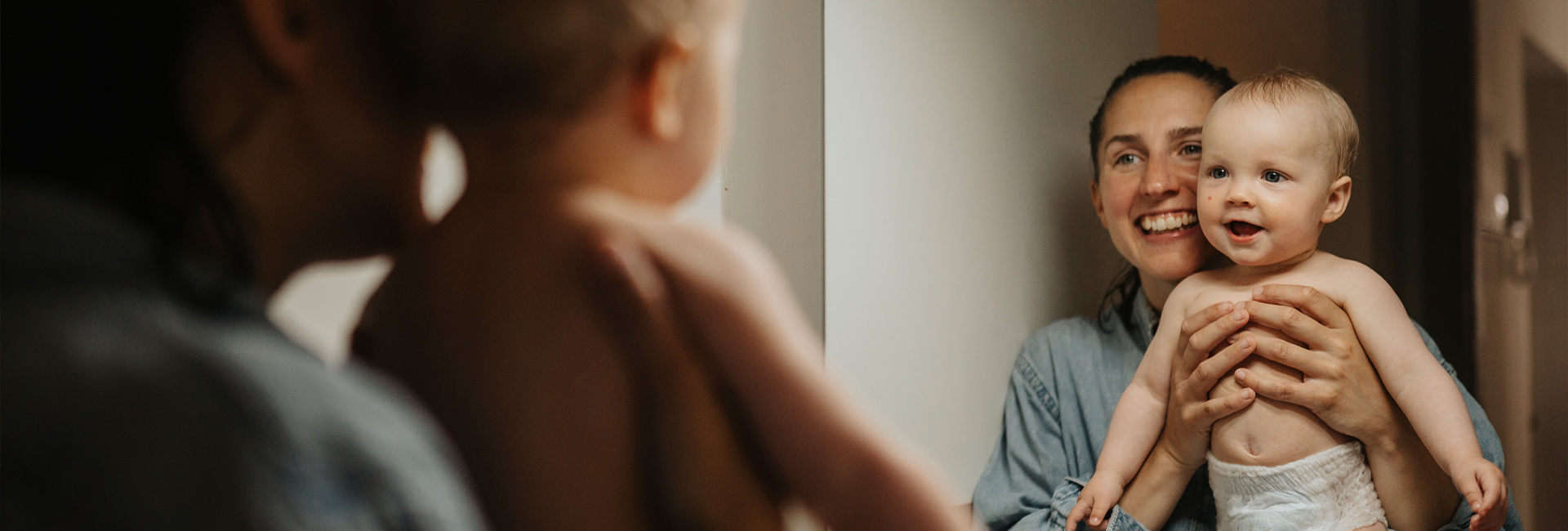 Mom and baby in mirror